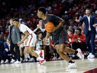 Oklahoma guard Grant Sherfield (25) brings the ball up the court during the first half of an...