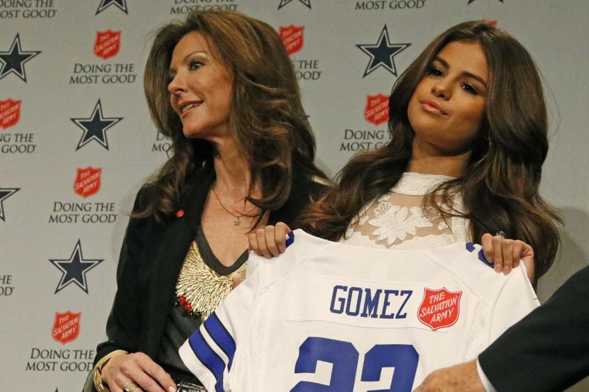 Charlotte Jones and Singer Selena Gomez pose for a photo during a press conference...