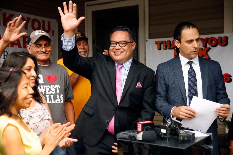 Omar Narvaez (center), then-Dallas City Council District 6 candidate, waved to residents and...