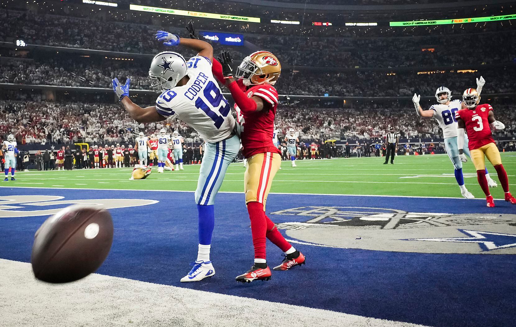 A pass by Dallas Cowboys quarterback Dak Prescott sails over the head of wide receiver Amari...