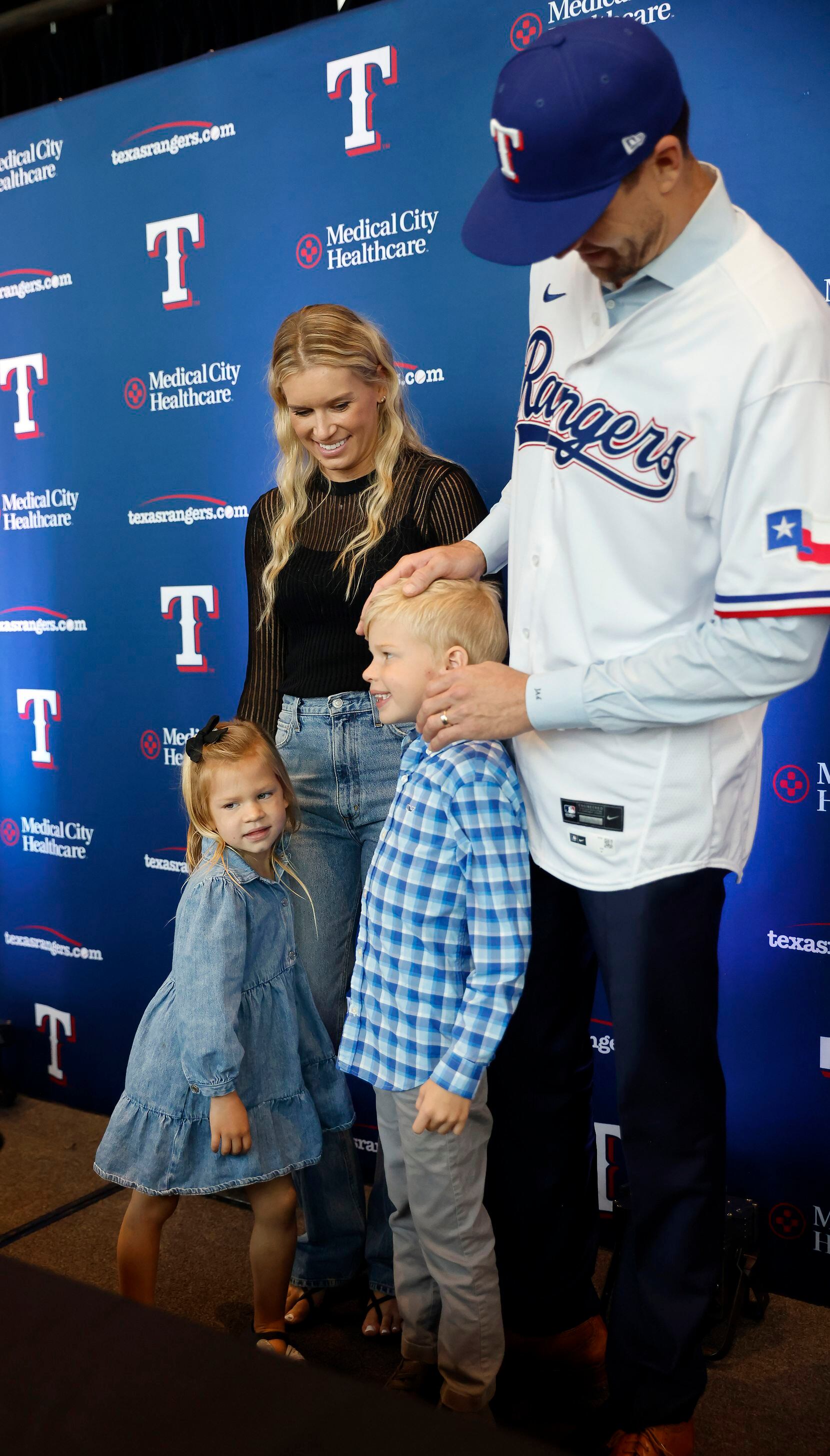 New Texas Rangers starting pitcher Jacob deGrom posed photos with his wife Stacey Harris,...