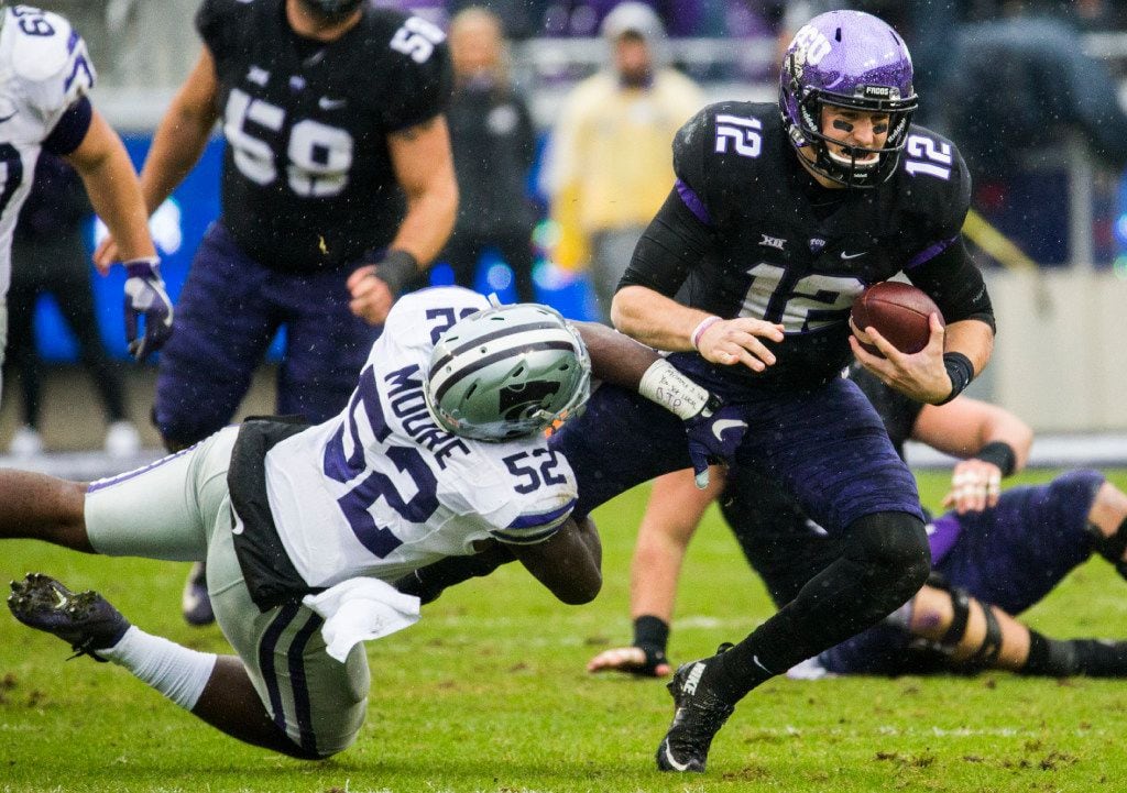 TCU Horned Frogs quarterback Foster Sawyer (12) is tackled by Kansas State Wildcats linebacker Charmeachealle Moore (52) during the second quarter of their game on Saturday, December 3, 2016 at Amon G. Carter Stadium in Fort Worth. (Ashley Landis/The Dallas Morning News)