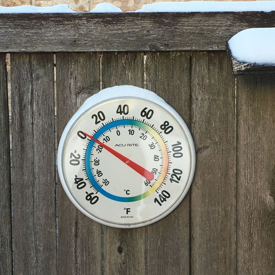 The outdoor temperature hovered close to zero degrees F on Tuesday morning, Feb. 16, 2021 in an East Dallas backyard, as unprecedented and dangrous freezing cold weather gripped North Texas.