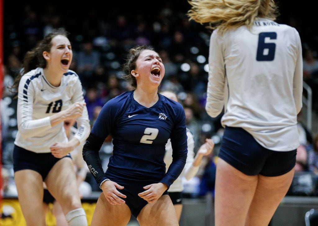Flower Mound junior Sarah Martinez (2), senior Abby Butler (10) and sophomore Kaylee Cox (6) celebrate a point during the Class 6A volleyball state championship match against Ridge Point at the Curtis Culwell Center in Garland, Saturday, November 17, 2018. (Brandon Wade/Special Contributor)