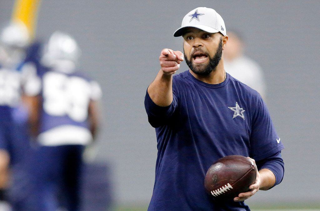 FILE - Cowboys defensive backs coach Kris Richard coaches his players up during a practice...