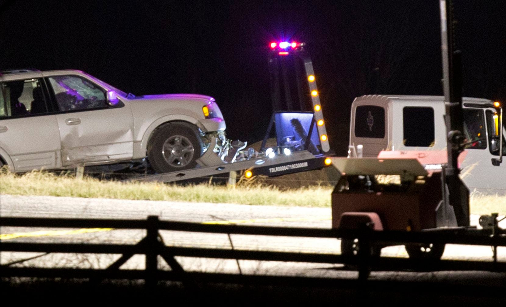 A vehicle is hauled onto a flatbed truck where the suspect of a deadly church shooting was...