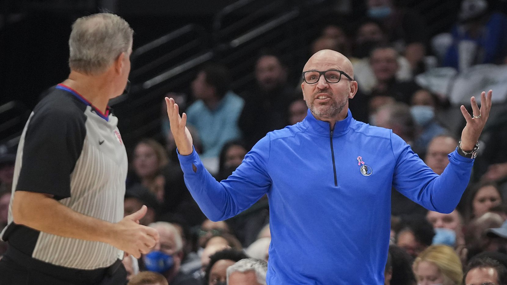 Dallas Mavericks coach Jason Kidd motions to an official during the first half of an NBA...