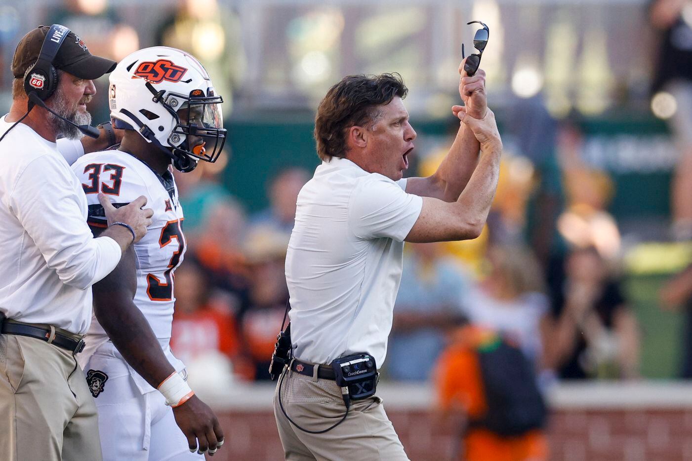 Oklahoma State head coach Mike Gundy argues for a penalty during the second half against the...