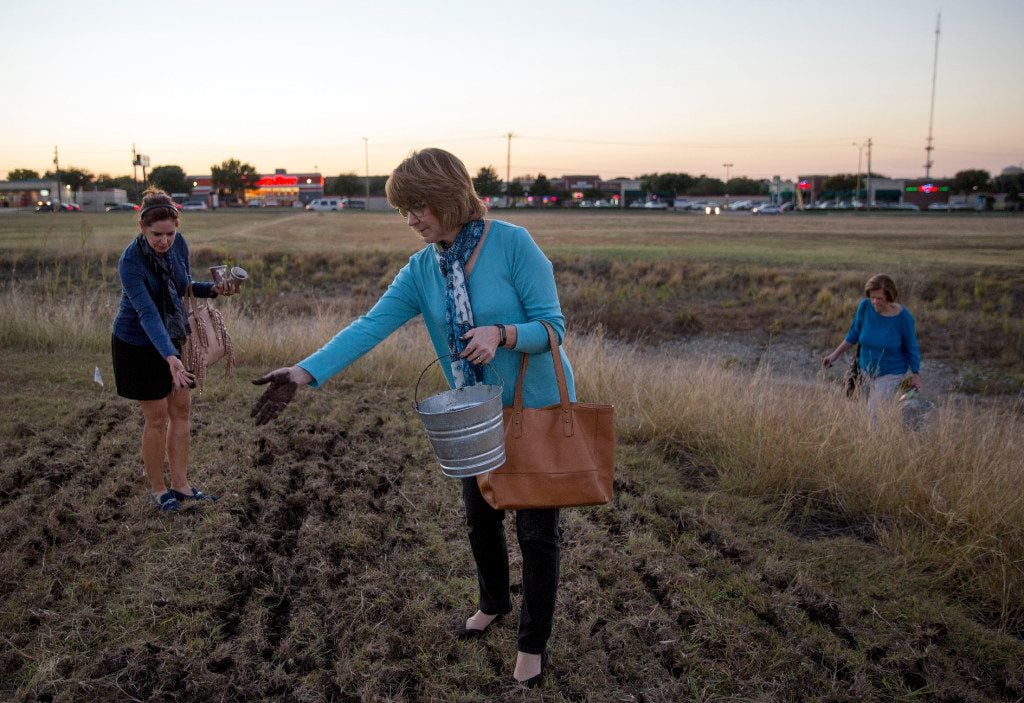 Mary Ruehle and Ann Willet toss their "seed bombs" into a field as Frances Jones joins them...