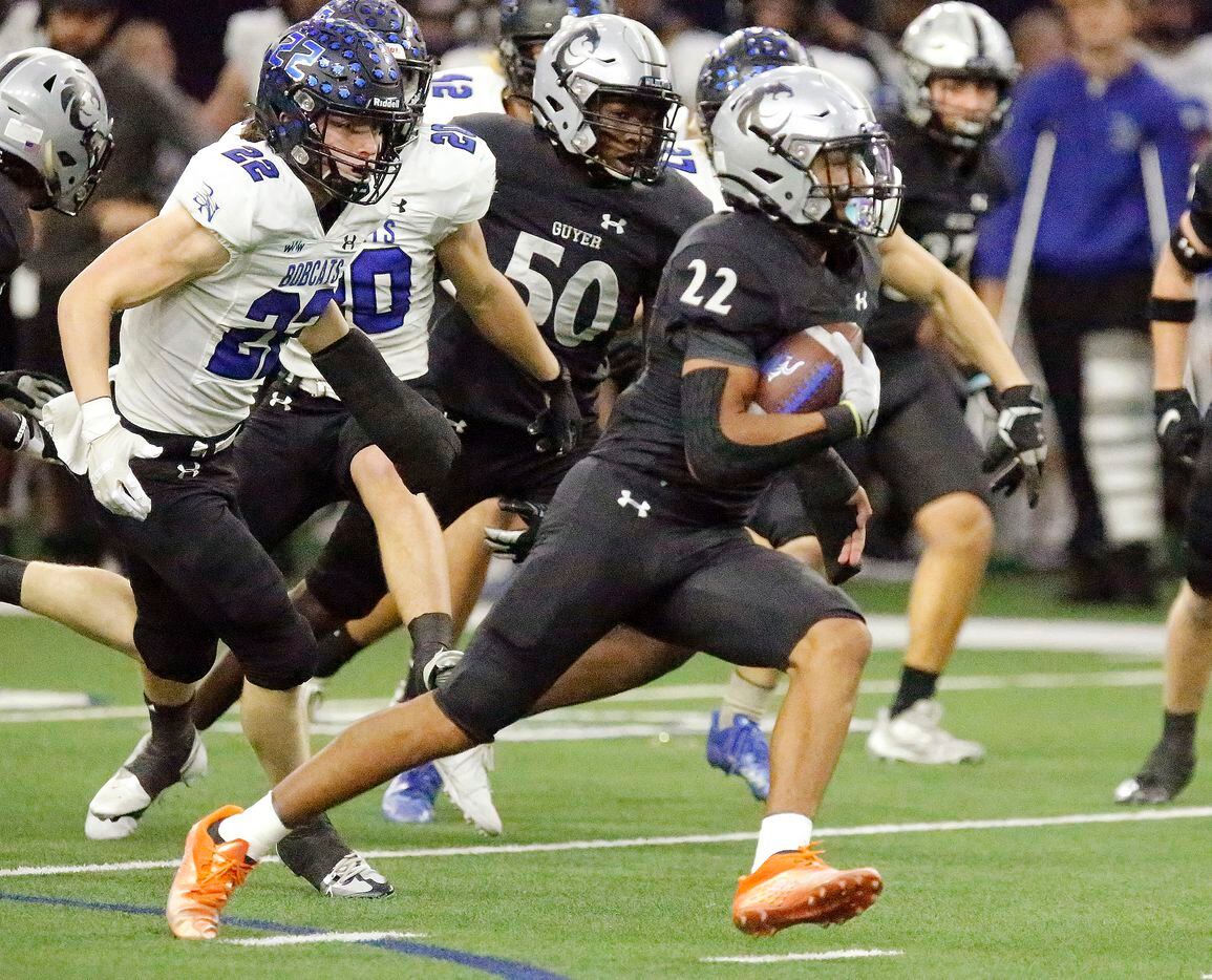 Guyer High School punt returner Peyton Bowen (22) returns a punt for a touchdown on the...