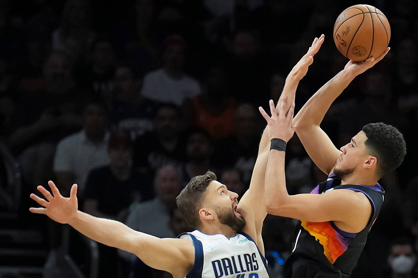 Phoenix Suns guard Devin Booker (1) shoots over Dallas Mavericks forward Maxi Kleber (42)...