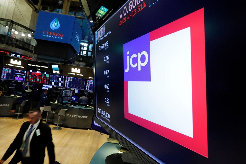 The JC Penney logo appears above a trading post on the floor of the New York Stock Exchange...