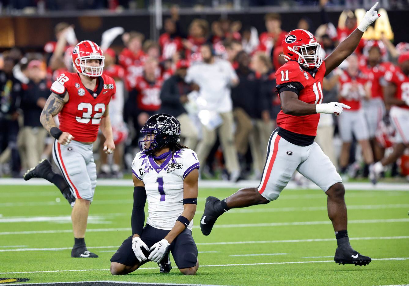 TCU Horned Frogs wide receiver Quentin Johnston (1) is slow to get up as Georgia Bulldogs...