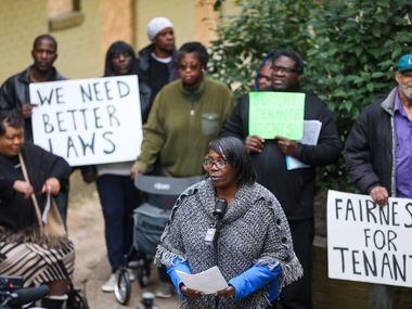 Odette Edwards, center, speaks at Bryan Song Apartments on Tuesday. Edwards, like all of the...