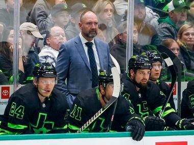 Dallas Stars head coach Peter DeBoer watches during the third period of an NHL hockey game...
