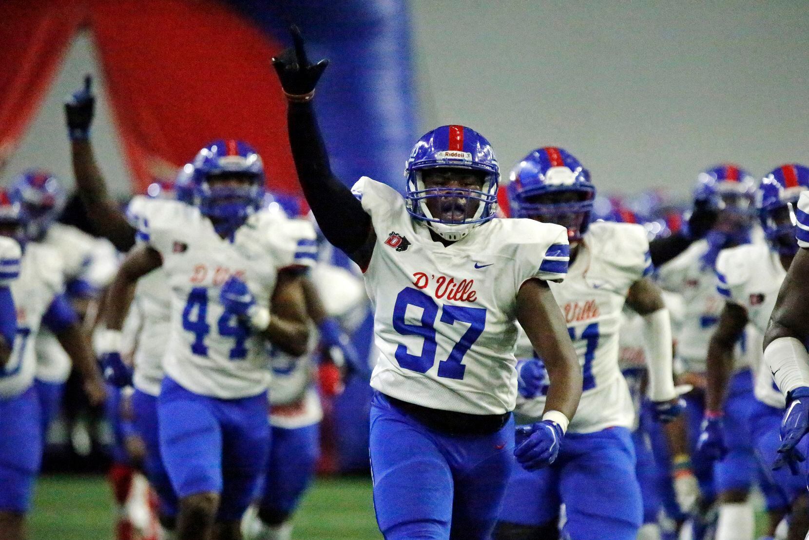 Duncanville High School defensive lineman Dil’Anthony Cole (97) runs onto the field with his team before kickoff as DeSoto High School played Duncanville High School in the Class 6A Division I Region II final playoff game at the Ford Center in Frisco on Saturday, December 4, 2021. (Stewart F. House/Special Contributor)