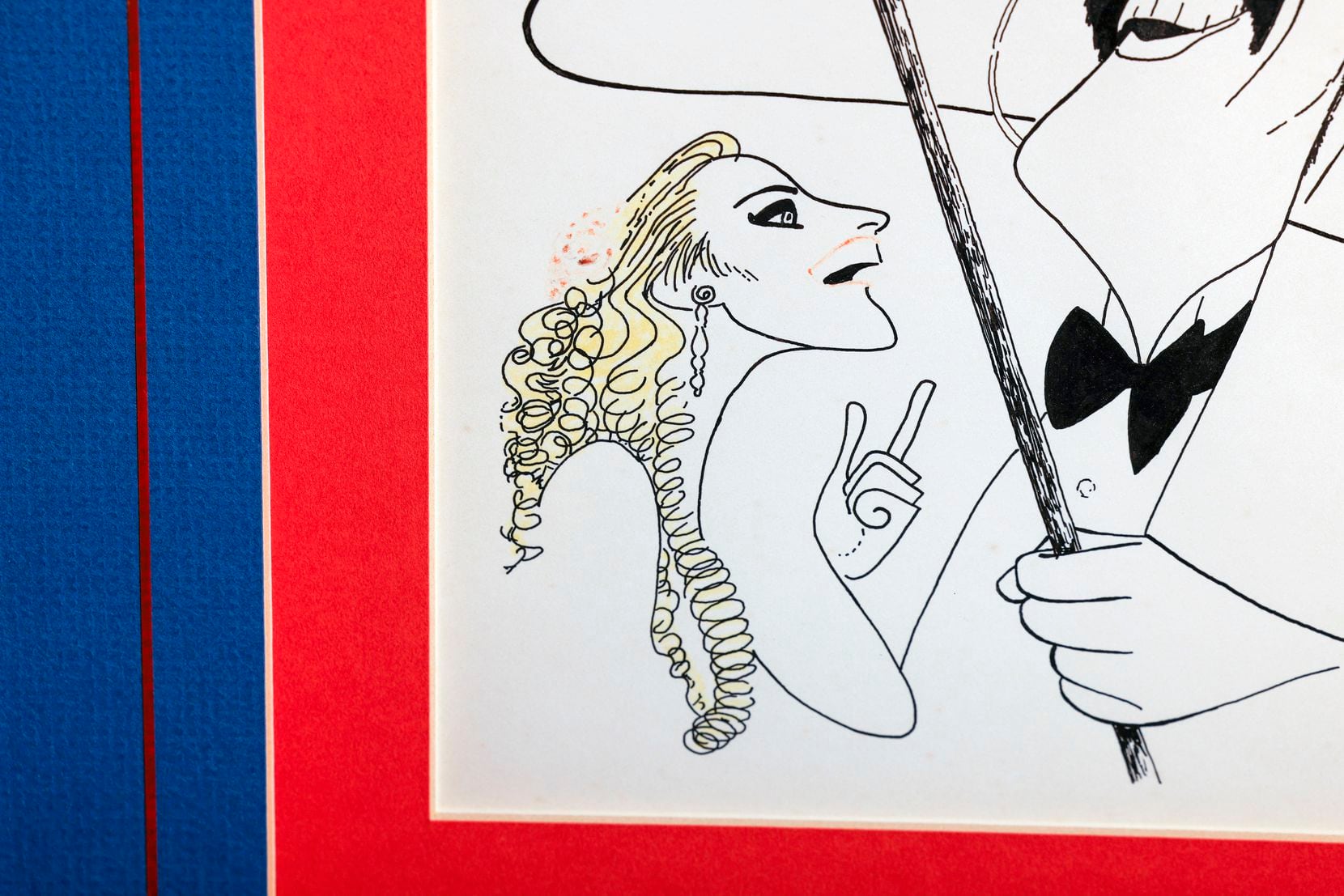 A detail view of the Al Hirschfeld drawing shows some of the image's unusual touches of color.