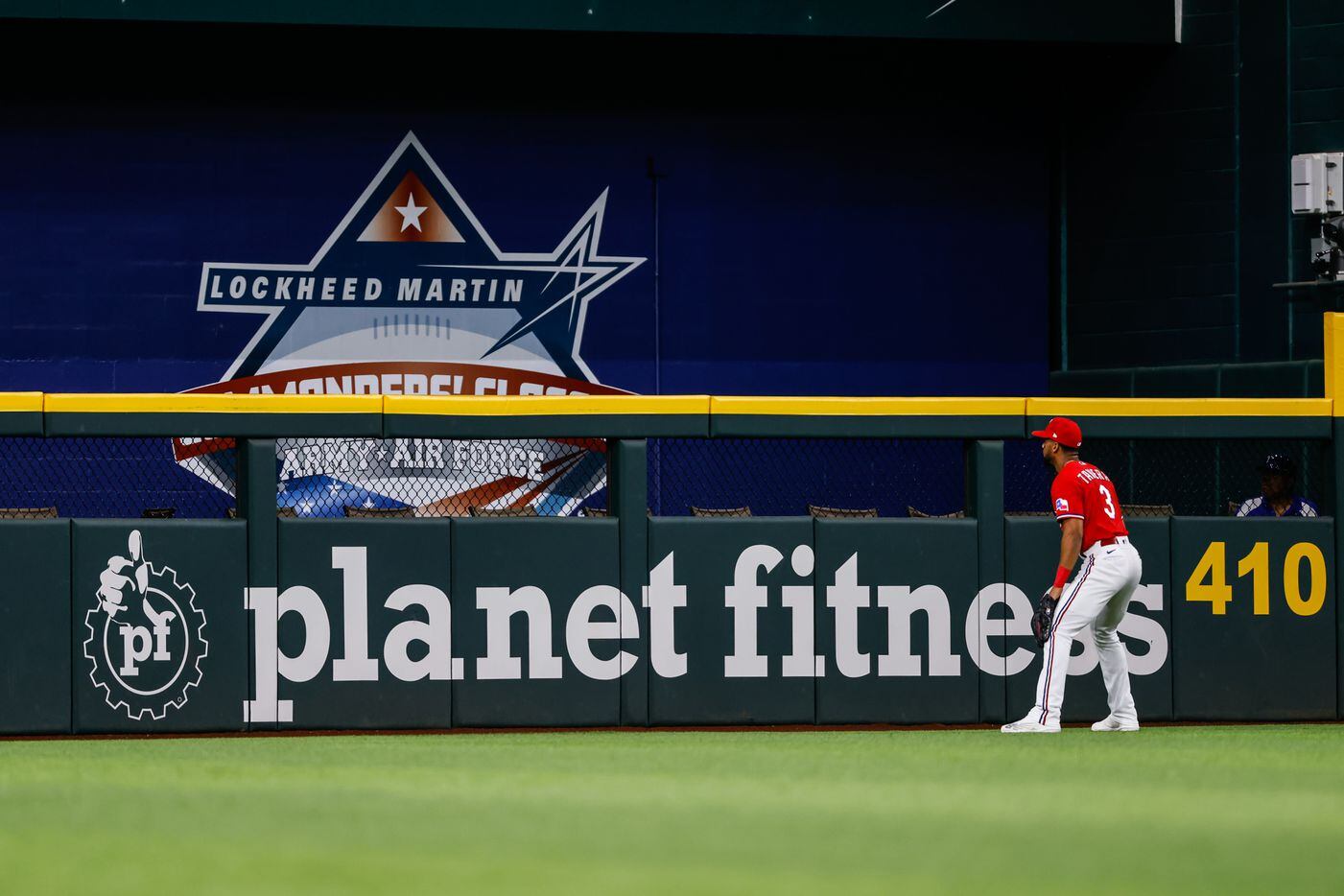 Texas Rangers center fielder Leody Taveras (3) watches the ball fall in the home run zone...