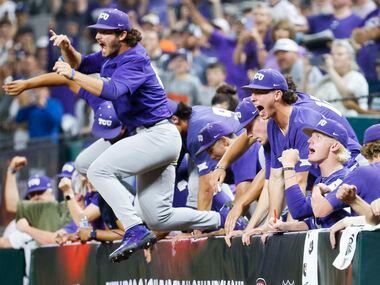 TCU players rush out of the dugout after winning the Big 12 baseball championship game...