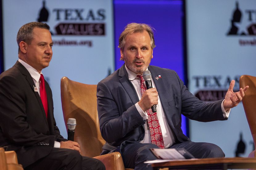 Moderator Jonathan Saenz listens as Sen. Bryan Hughes talks on a panel discussion on the...
