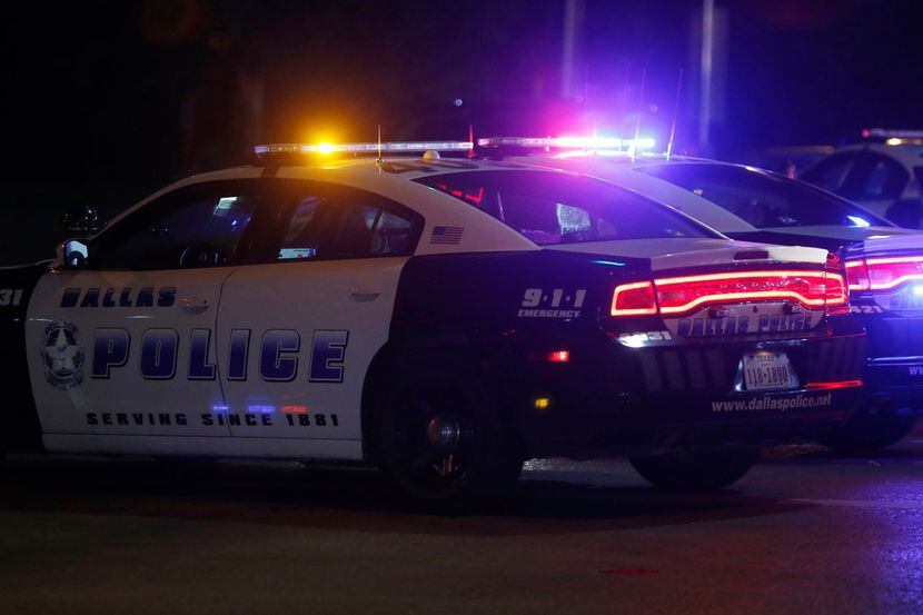 Dallas Police department at the scene of a shooting where a 13-year-old boy died after being...