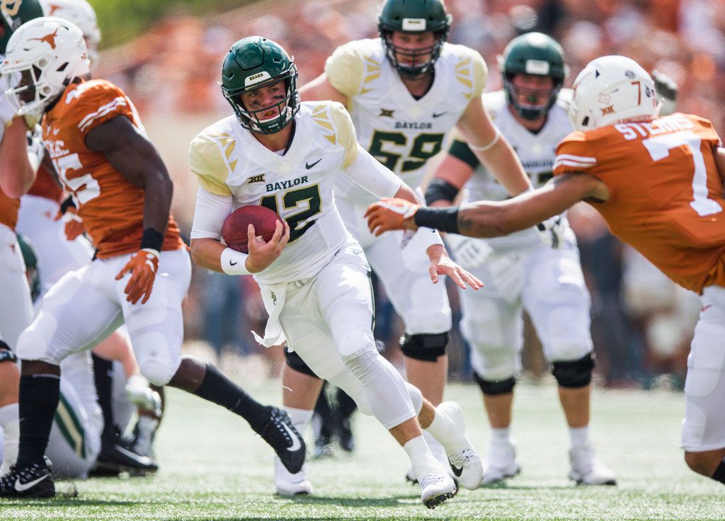 Baylor Bears quarterback Charlie Brewer (12) runs the ball during the first quarter of a...