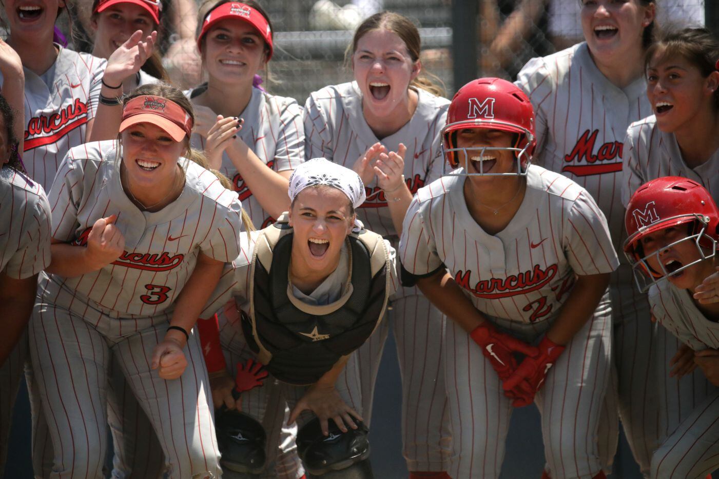 The team waits at home plate as Flower Mound Marcus High School player #2, Makayla Dudley,...