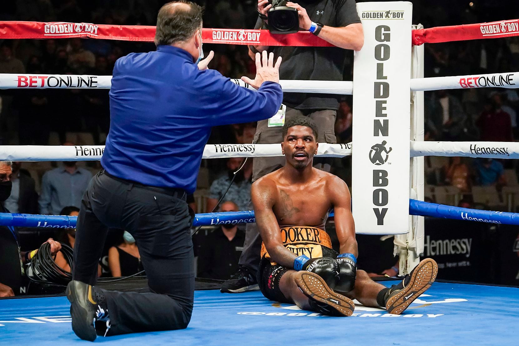 Maurice Hooker waits out an eight count from for referee Laurence Cole after being knocked to the canvas by Vergil Ortiz Jr. while fighting for the vacant WBO international welterweight title at Dickies Arena on Saturday, March 20, 2021, in Fort Worth.
