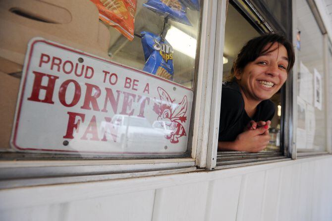 In this April 15, 2013 photo, Staci Ward takes your order at the Hornet Drive-In, the gossip...