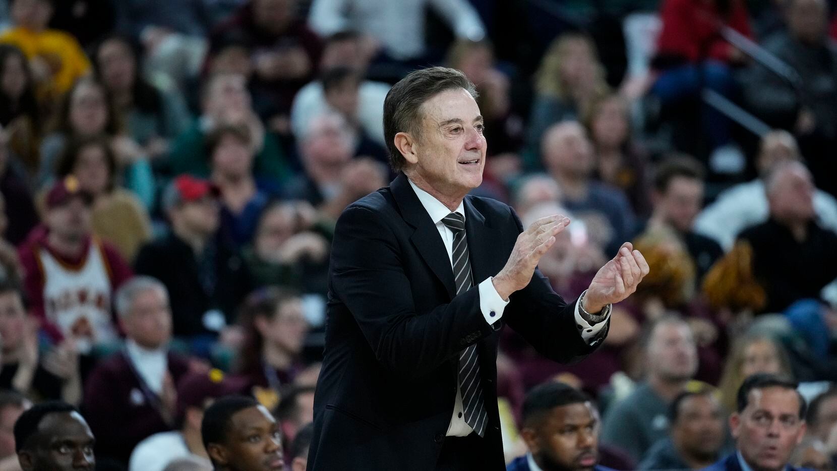 Iona head coach Rick Pitino calls out during the second half of an NCAA college basketball...