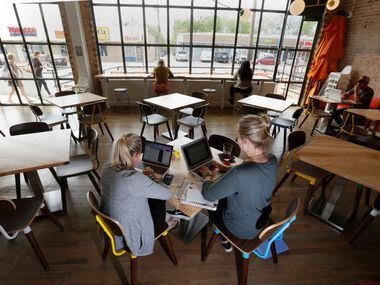 SMU graduate students, Taylor Cox, left and Shelby Smith, study in the dinning area at the...
