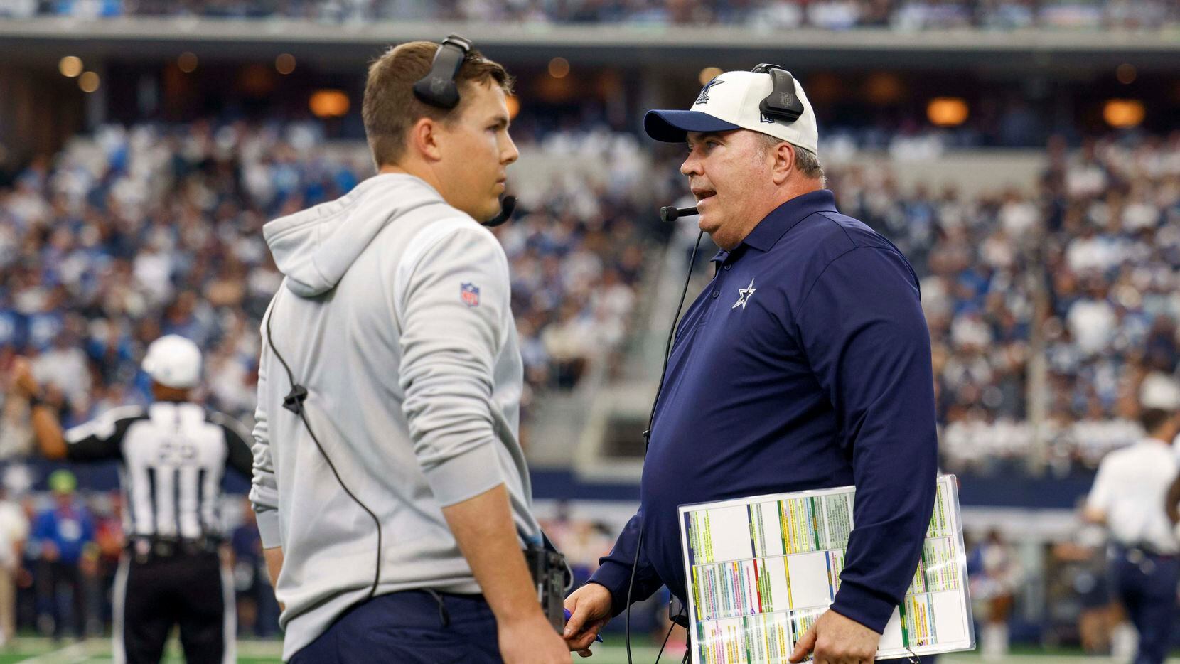 Dallas Cowboys head coach Mike McCarthy (right) talks with offensive coordinator Kellen...