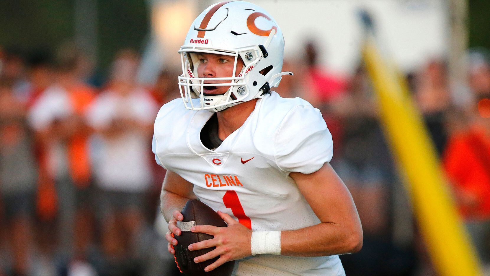 Celina High School quarterback Noah Bentley (1) rolls out to pass during the second half as Melissa High School hosted Celina High School at Cardinal Field in Melissa on Friday night, August 27, 2021. (Stewart F. House/Special Contributor)