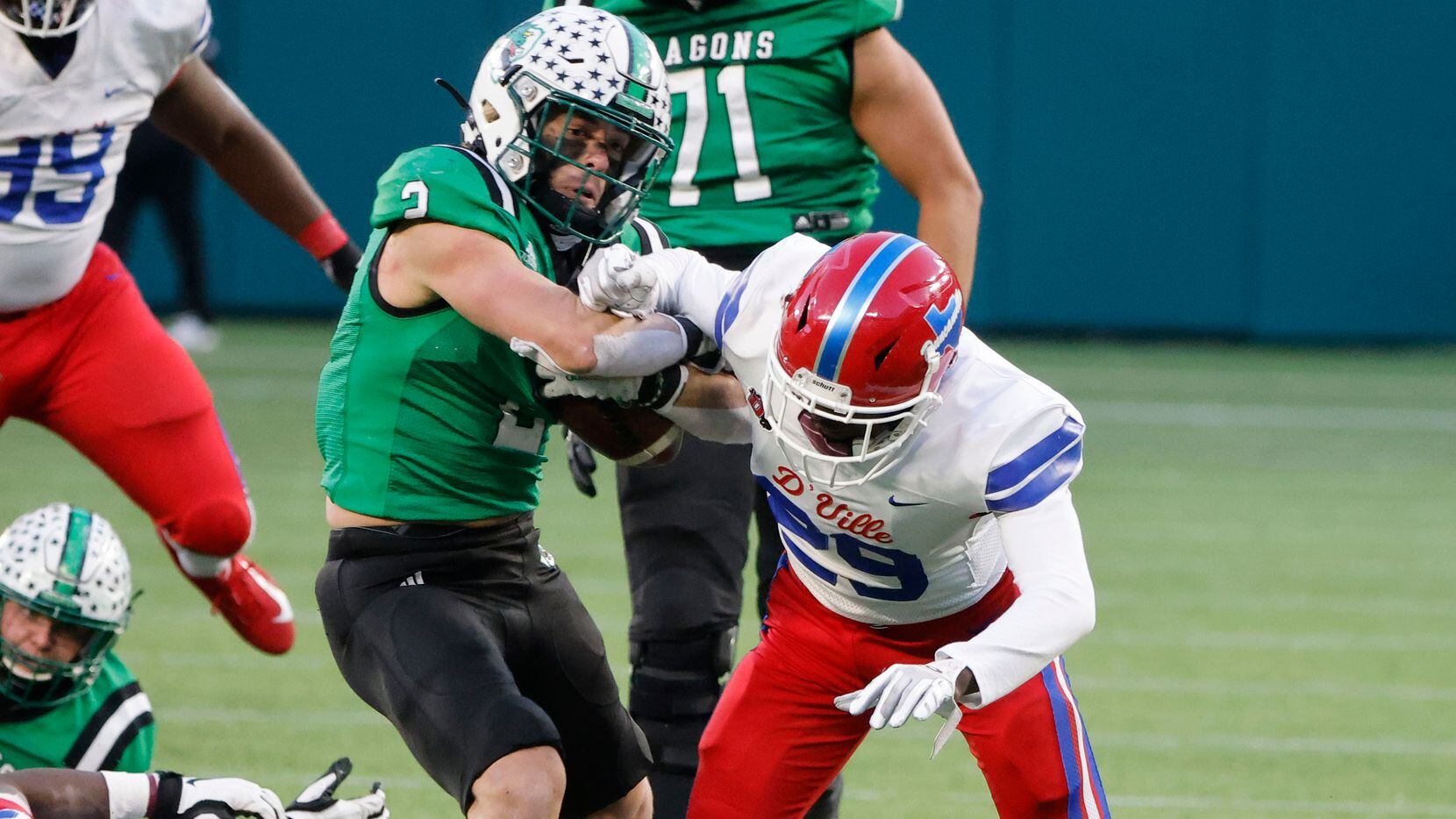 Southlake running back Owen Allen bounces off an attempted tackle by Duncanville defender Willie Angton Jr. (29) to score a touchdown during the Class 6A Division I state high school football semifinal in Arlington, Texas on Jan. 9, 2020. (Michael Ainsworth)