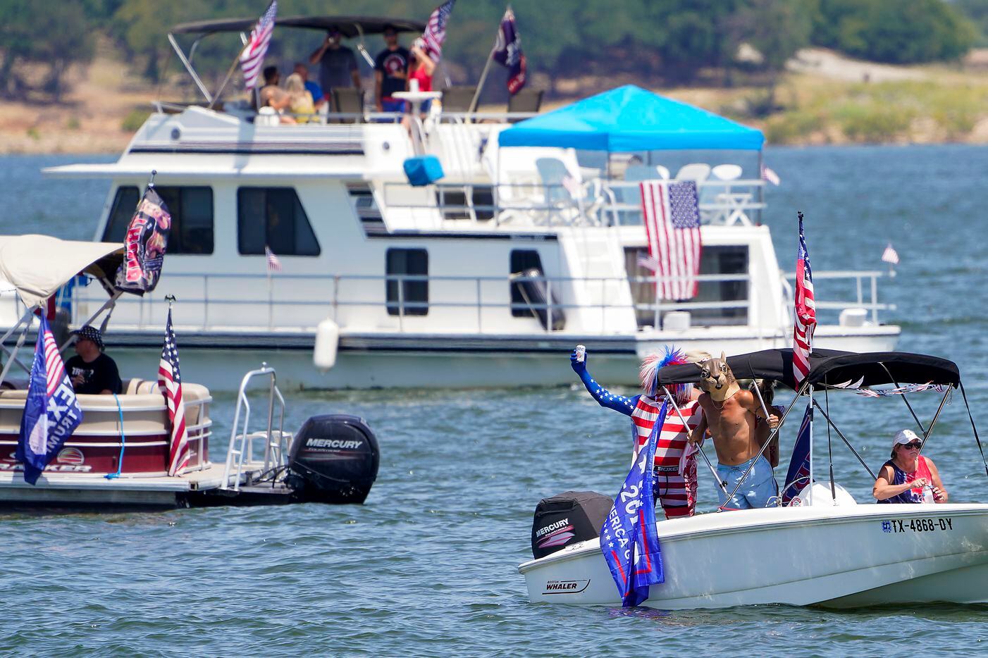 Boaters gather in support of President Donald Trump for a rally and boat parade at Oak Grove Park on Grapevine Lake on Saturday, Aug. 15, 2020.