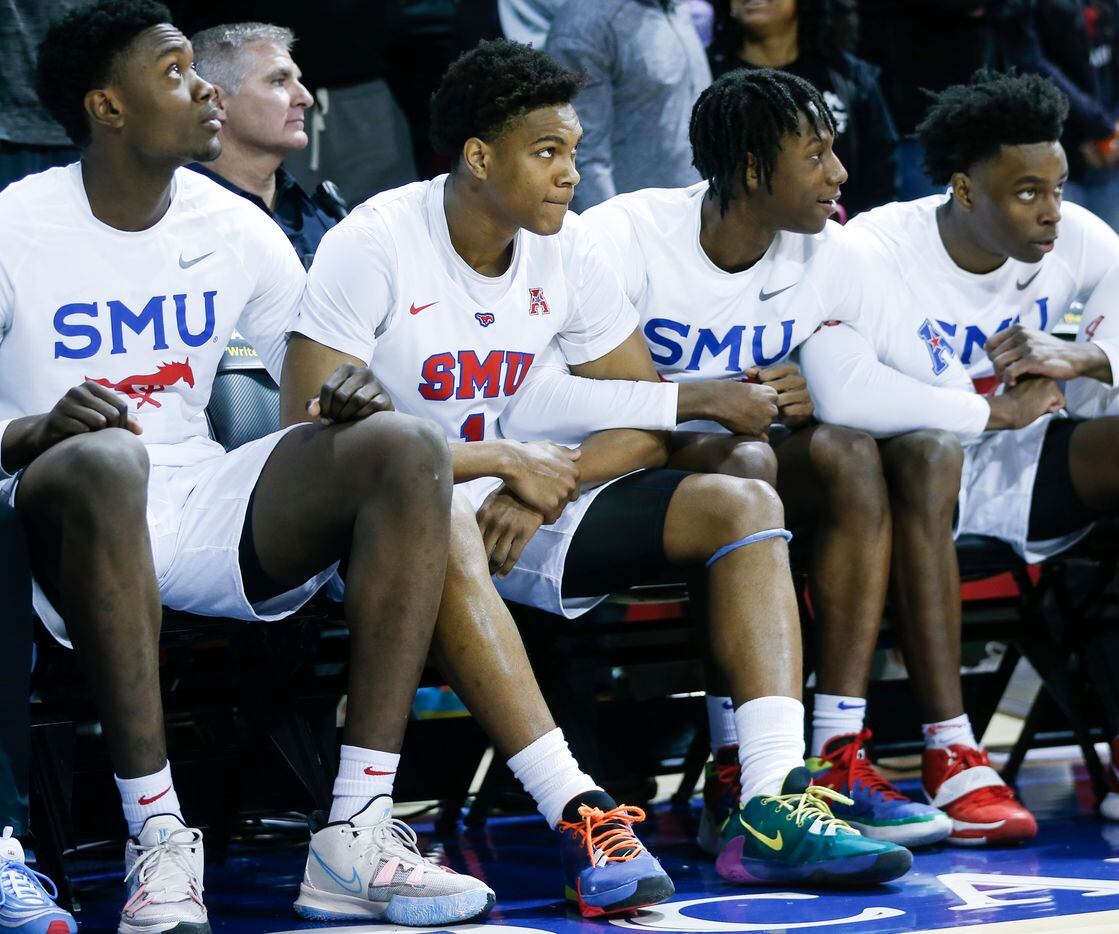 Southern Methodist University players watch the second half of the game at Moody Coliseum in...