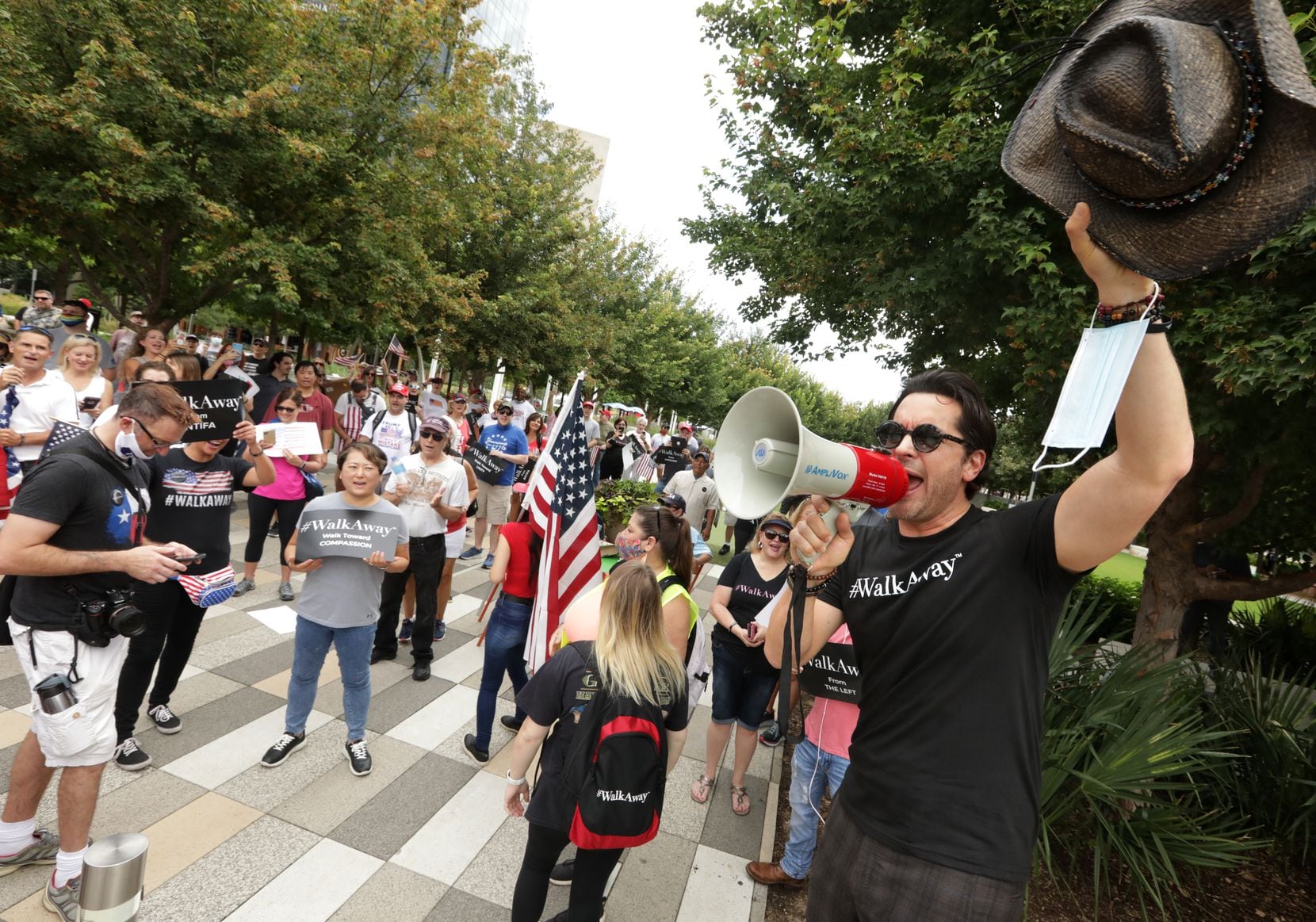 Brandon Straka (right), founder of the #WalkAway Campaign movement, and demonstrators get...
