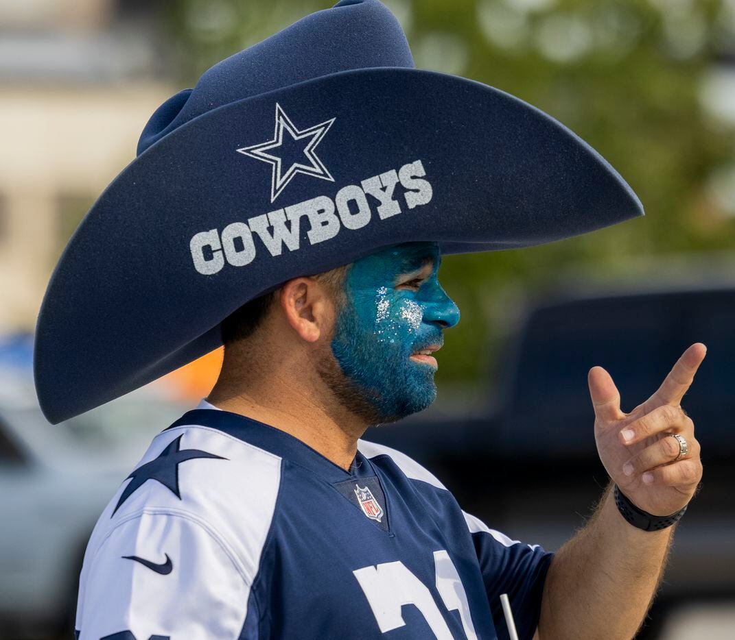 Mike Wasso of Vacaville, Calif. dons facepaint before the start of the Cowboys game against...