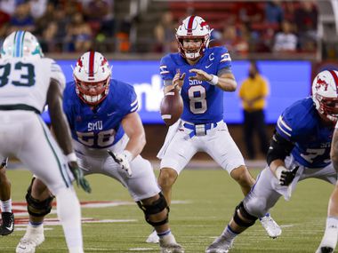 Southern Methodist Mustangs quarterback Tanner Mordecai (8) catches the snap during the second quarter of a game against the Tulane Green Wave on Thursday, Oct. 21, 2021, at Gerald J. Ford Stadium on the campus of SMU in Dallas.