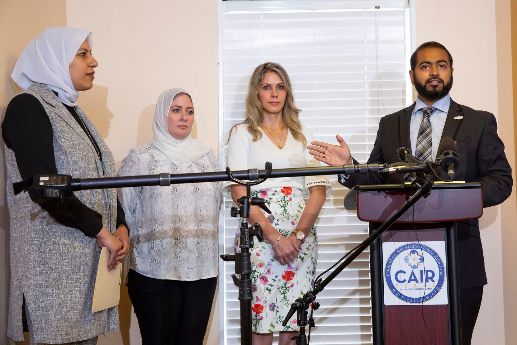 (From right) Faizan Syed, Executive Director of the DFW chapter of the Council on American-Islamic Relations speaks as sisters Muna Kowni and Fatima Altakrouri with their attorney Marwa Elbially listen at a press conference outlining a complaint the sisters filed against Southwest Airlines for alleged religious discrimination on Tuesday, June 1, 2021, in Plano. (Juan Figueroa/The Dallas Morning News)