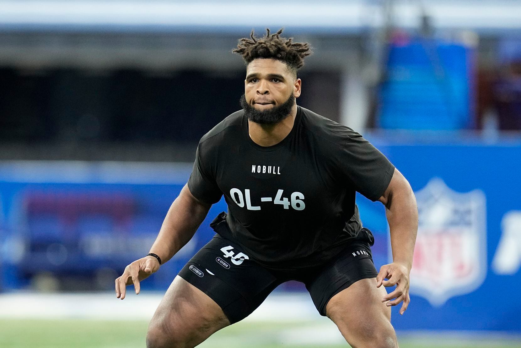Florida offensive lineman O'Cyrus Torrence runs a drill at the NFL football scouting combine...