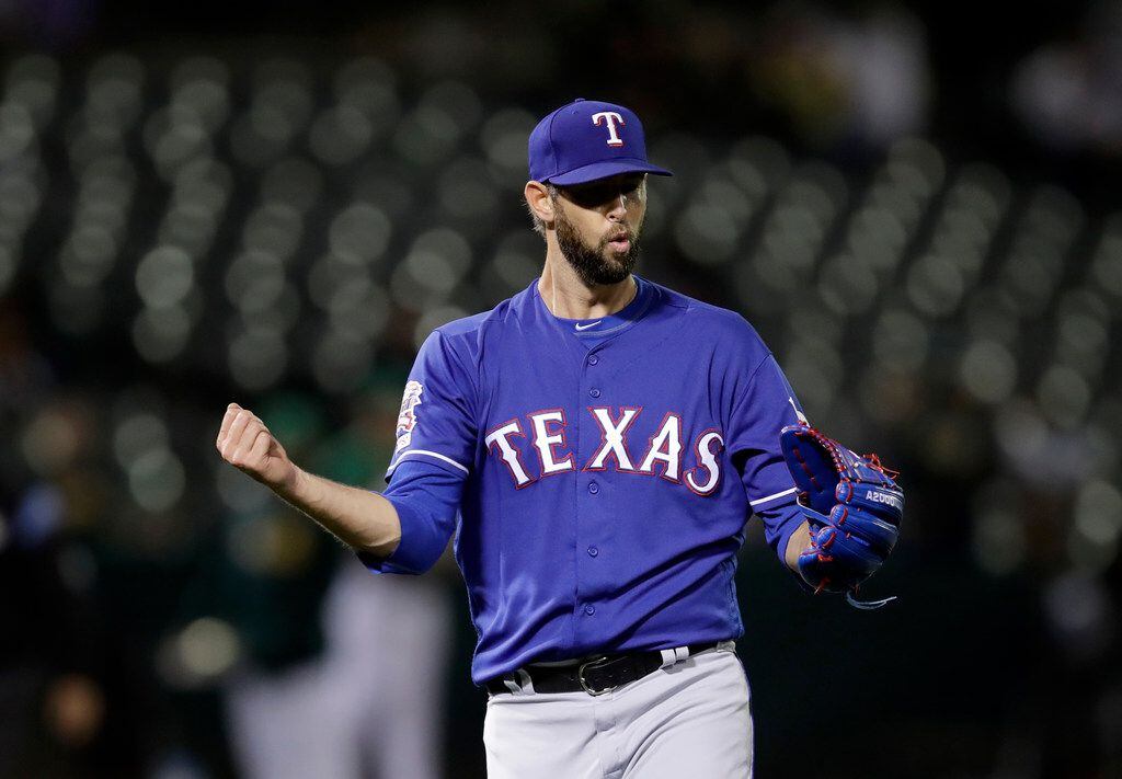 Texas Rangers pitcher Chris Martin celebrates the 5-2 win as the final out is made against...
