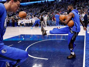 Dallas Mavericks forward Tim Hardaway Jr. (11) divvies up basketballs, soccer style, during...