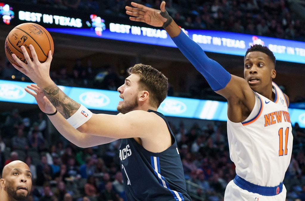 Dallas Mavericks guard Luka Doncic (77) drives to the basket past New York Knicks guard Frank Ntilikina (11) during the first half of an NBA basketball game at American Airlines Center on Friday, Nov. 8, 2019, in Dallas. (Smiley N. Pool/The Dallas Morning News)