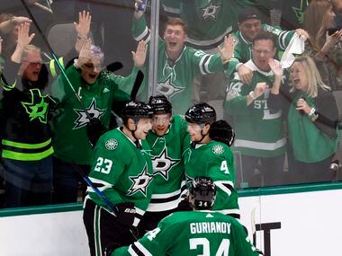 Fans congratulate Dallas Stars center Radek Faksa (12) on his first period goal in Game 3 of...