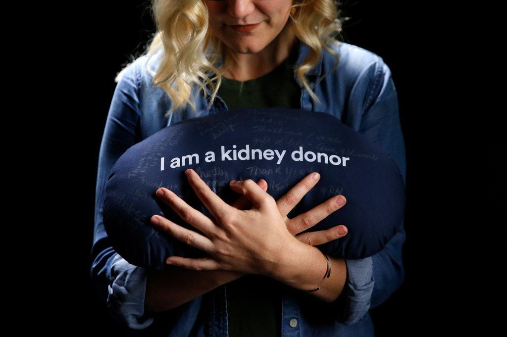 Leah Waters clutches a kidney-shaped pillow that she received at Medical City Fort Worth to...