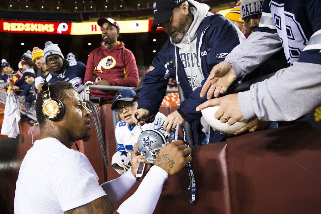 Dallas Cowboys defensive end Greg Hardy signs autographs for fans before an NFL football...
