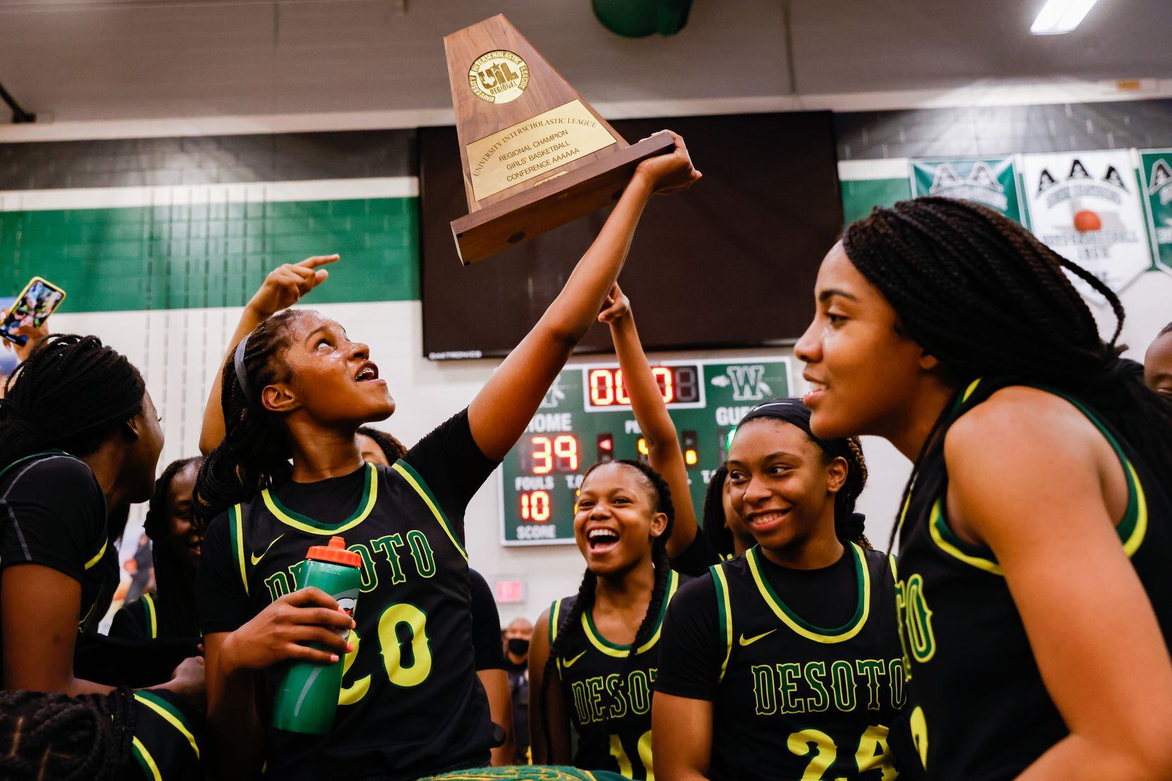 DeSoto basketball team members celebrated their win against Duncanville after the Class 6A Region II UIL playoff game March 2 in Waxahachie. DeSoto won 52-39.
