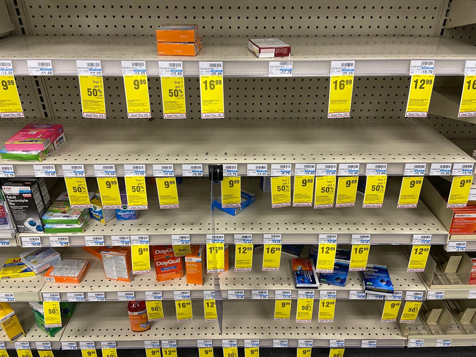 The cold remedy aisle at a CVS on Forest Lane in Dallas on Monday. The store is offering discounts on products it can't keep in stock.