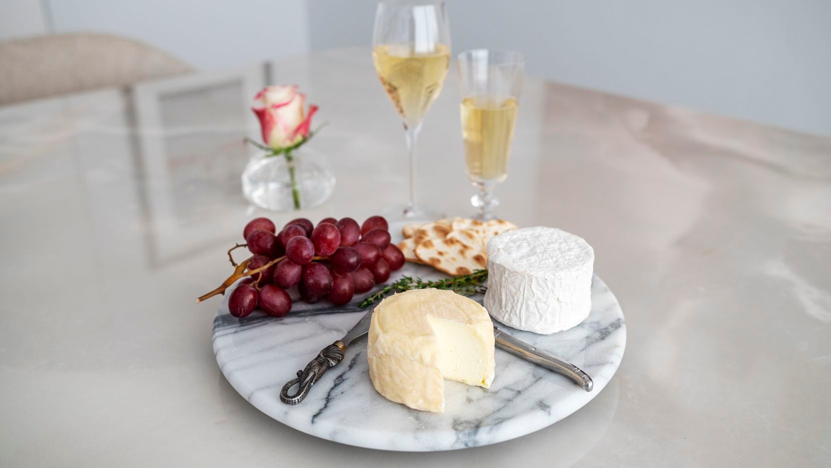 Haute Goat's Chaource, made in Longview, bottom center, and Cowgirl Creamery Mt. Tam triple cream cheese, paired with a brut Champagne and a California sparkling wine